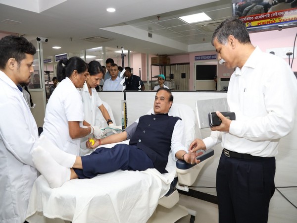 Leader donating blood — encouraging blood donation drive